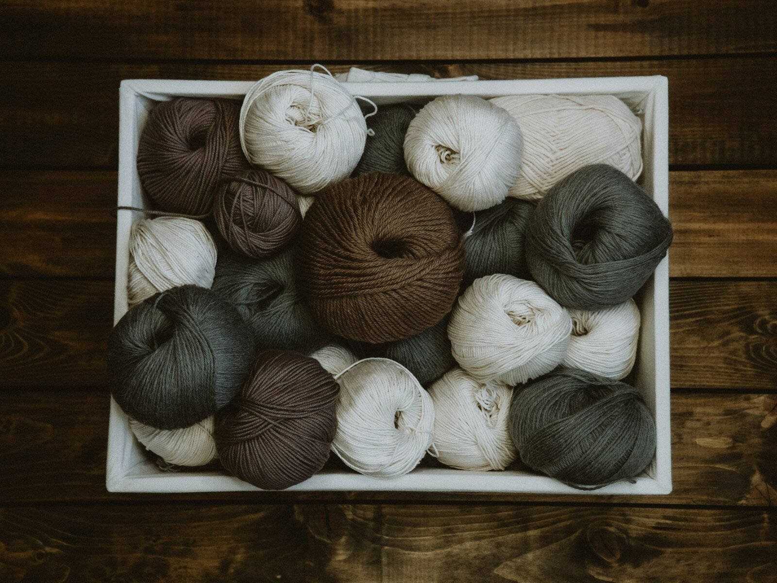 stash buster of yarn in a box on the floor